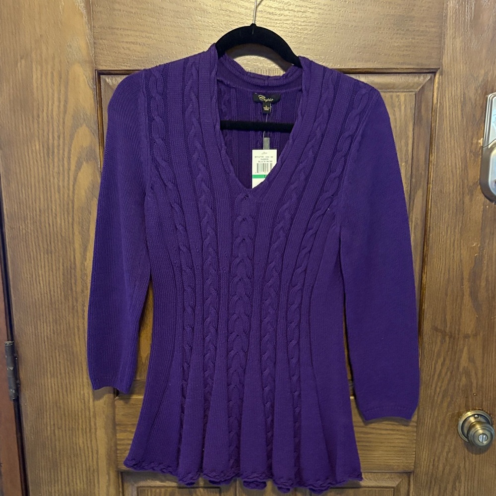 This new purple sweater has an aline shape to it.